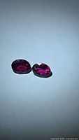 Two oval rubellite tourmalines shown face up