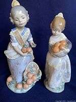 Both Lladró figurines front view