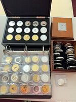 Overall view of three coin cases and loose coin