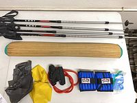 Three LEKI poles, rolled mat, bands, ankle weights overview