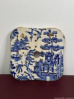 front view of Blue Willow drainer showing pattern and perforations