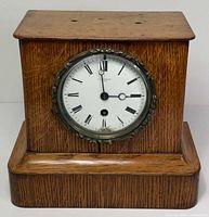 Front view showing full oak case and dial