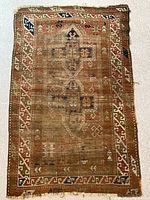 Full view of rug showing overall design and wear