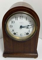 Front view of Seth Thomas beehive mantle clock showing dial and case