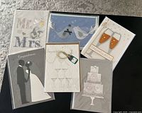 Fronts of six wedding-themed greeting cards displayed
