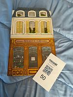 Front view closed, shows printed building façade and scale reference card