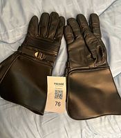 Both gloves laid flat showing full length and design