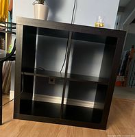 Front view showing four open cubes and finish