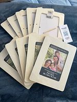 Stack of ten unfinished ArtMinds 4"x6" wood frames fanned out