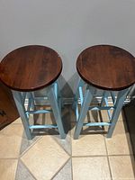 Both stools top view showing stained round seats