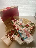 Towels, placemats and gift box group shot