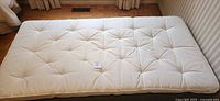 Full view of tufted twin cushion