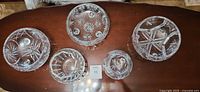 Top view of all five footed cut crystal bowls showing varied patterns