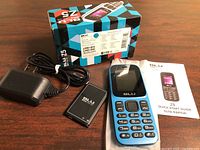 Handset, battery, charger, guide and box overview