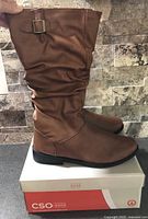 full view of both boots on box