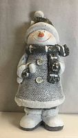 Front view snowman statue concrete/resin 7x16 in holding candy cane