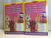 Front view showing two sealed packs of temporary tattoos