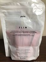 Front of Plexus Slim pouch showing product name and flavor