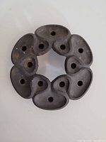 Top view of cast iron lotus candle holder showing eight taper sockets
