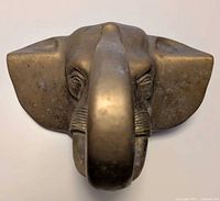 Front view of brass elephant head hanger