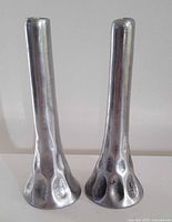 Front view of both aluminum candle holders