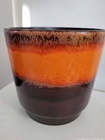 Front view showing orange and brown glaze finish