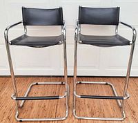 Front view of both chrome cantilever bar stools