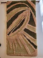 Front view of latch hook wall hanging showing full design