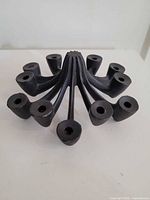 Full view of 12-arm cast iron candle holder