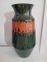 Full view of vase showing green glaze and orange band