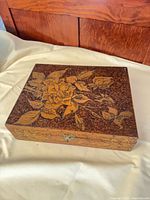 Top view of wooden box showing floral design