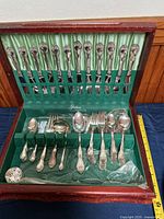 Open flatware chest showing all pieces