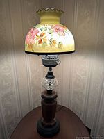 Full view of hurricane oil lamp on table