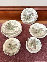 Stacks of The Road Home plates showing quantity and pattern