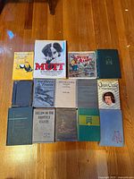 All 14 books front covers visible