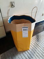 Paper shopping bag containing assorted samples