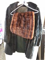 Full view of jacket on hanger with mink stole draped over front