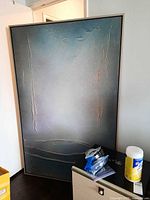 Full view of framed abstract painting showing textured surface and gradient coloring