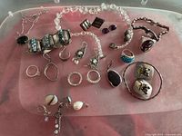 Mixed sterling jewelry laid out showing all pieces