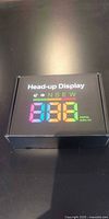 Sealed box front showing Head-up Display logo and multicolour numeric display illustration