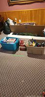 Overall lot showing tree box and two storage totes