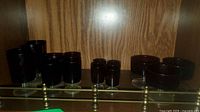 Full set of ruby red stemware on shelf