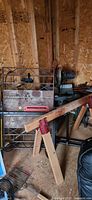 Overall view of table saw, miter saw and workbench in shed