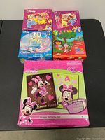 All five boxed items displayed on tabletop