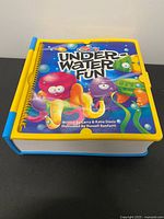 Front cover showing title, artwork, Fisher-Price Creatrix branding