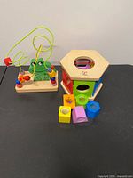 Both wooden toys side by side showing overall condition and components