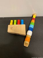 Rainbow wooden whistle and bird whistle block top view