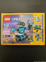 Front of sealed LEGO Creator Robo Explorer box showing piece count and age range