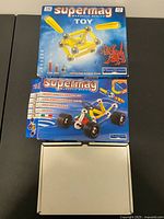 Two boxed Supermag sets stacked with open plain white box below