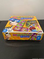 Front of Mega Bloks Domino Build game box